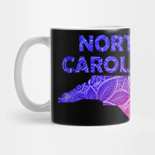 Colorful mandala art map of North Carolina with text in blue and violet Mug